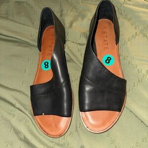 1. State Black Flats with Modern Design